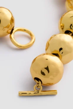 Hammered sphere necklace in gold-plated brass