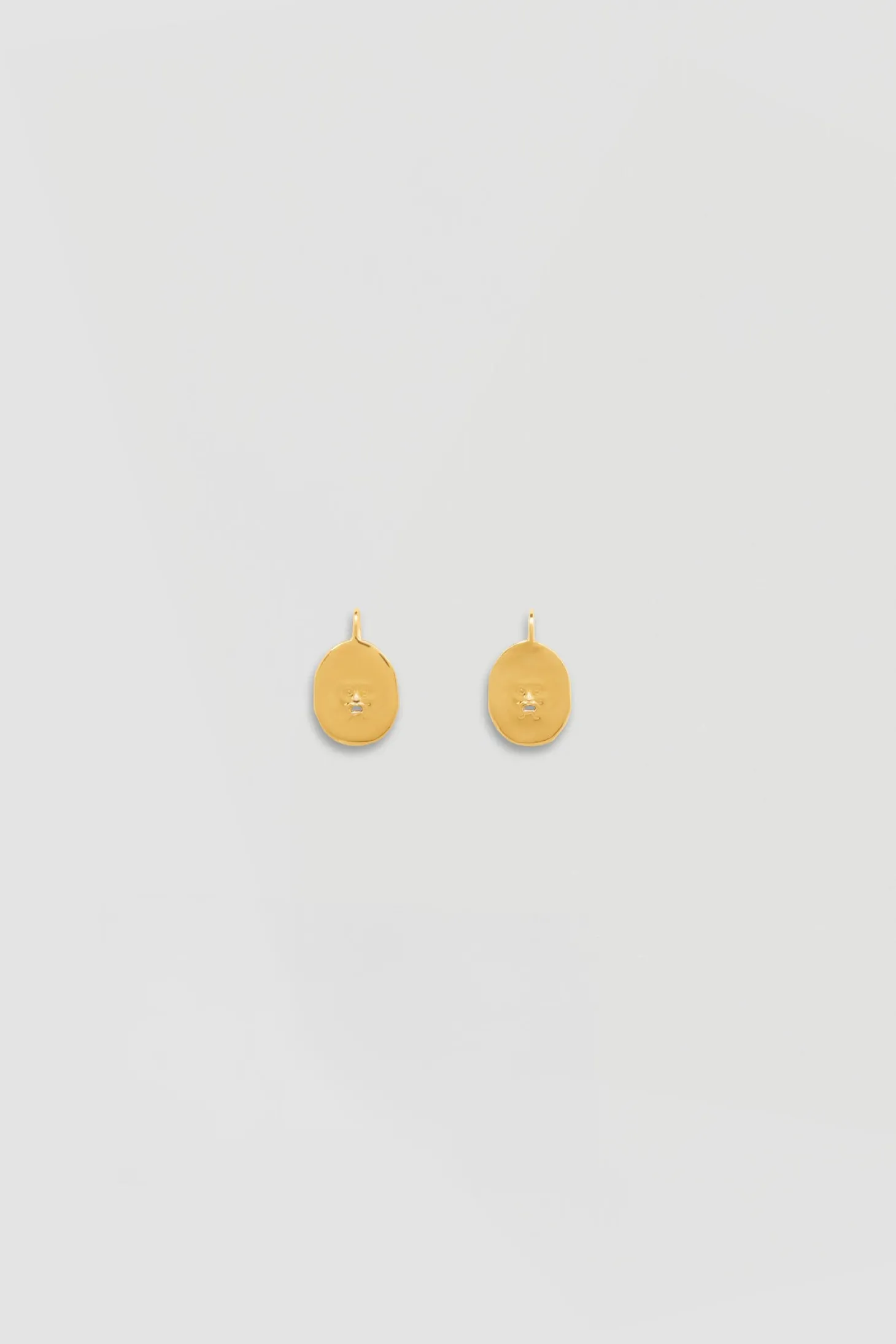 Small face brass earrings