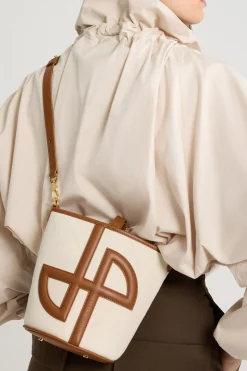 Small JP bucket bag in leather and canvas